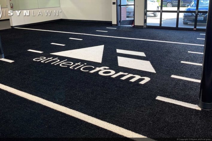 SYNLawn Milwaukee WI prefab turf logos for athletic weight room applications